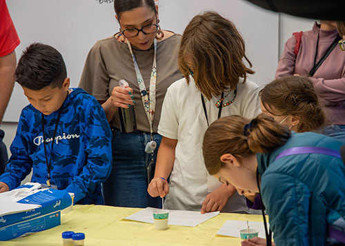 Attendees interacting at Science: Unrestricted