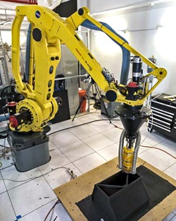 Researchers demonstrate a Zero Launch Mass 3-D printer in Swamp Works at NASA's Kennedy Space Center in Florida.