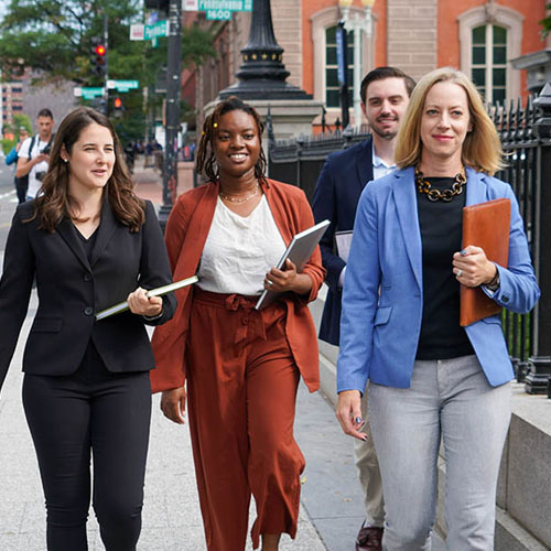 STPI Staff walking on Penn Ave